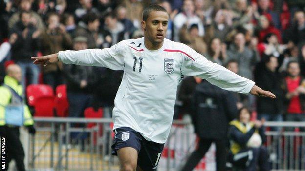 Wayne Routledge celebrates scoring for England Under-21s in the game which marked the opening of the new Wembley