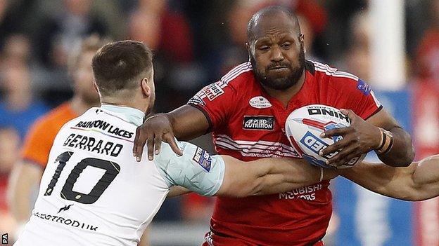 Salford's Robert Lui runs at a Widnes player