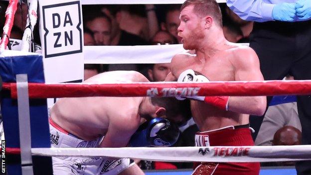 Saul 'Canelo' Alvarez lands a body shot on Rocky Fielding during the fight in New York