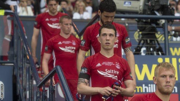 Aberdeen midfielder Ryan Jack collects his runner-up medal