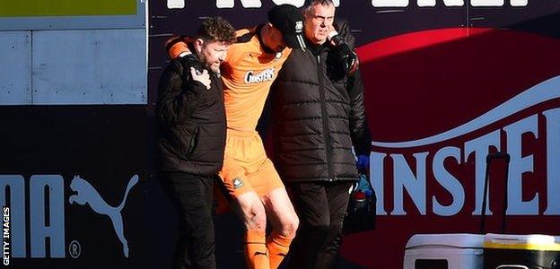 Matt Macey is carried off