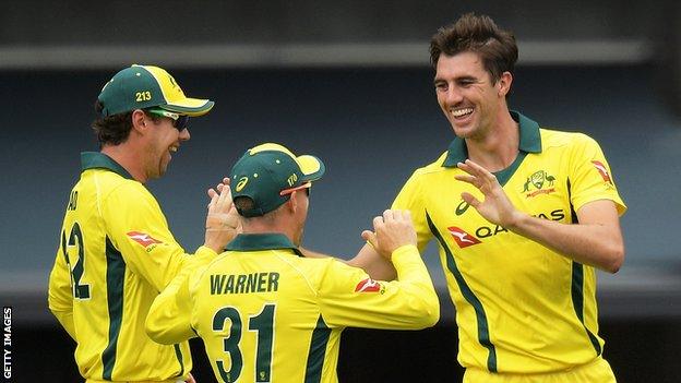 Australia's Pat Cummins celebrates taking a wicket in victory over England