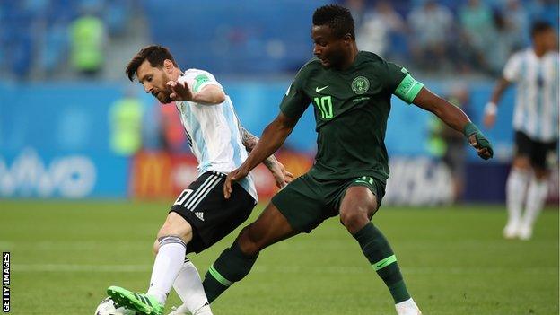 Lionel Messi and John Mikel Obi