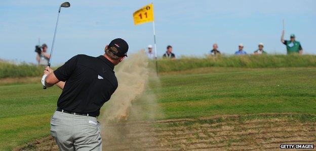 Ernie Els plays out of a bunker on the 11th hole during the second round of The 140th Open Championship at Royal St George's on July 15, 2011