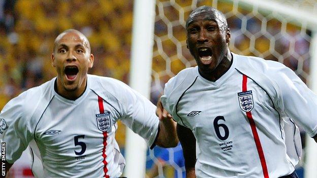 Sol Campbell (right) celebrates scoring for England