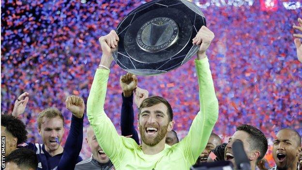 Matt Turner lifting the MLS Supporters Shield