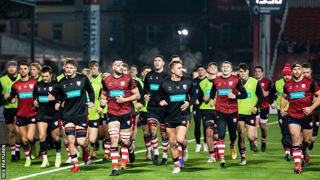 Gloucester players finish their pre-match warm-up at Kingsholm