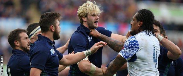 Richie Gray of Scotland grapples with Samoa's Teofilo Paulo during the 2015 Rugby World Cup