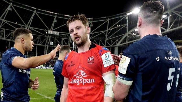 Leinster wing Adam Byrne [left] consoles Iain Henderson after last year's Champions Cup quarter-final