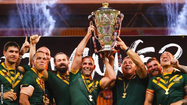 Australia players celebrate with the trophy after winning the 2017 men's Rugby League World Cup