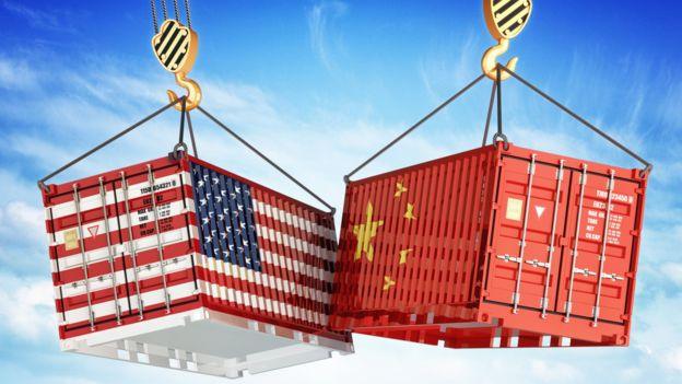 Shipping containers with US and Chinese flags