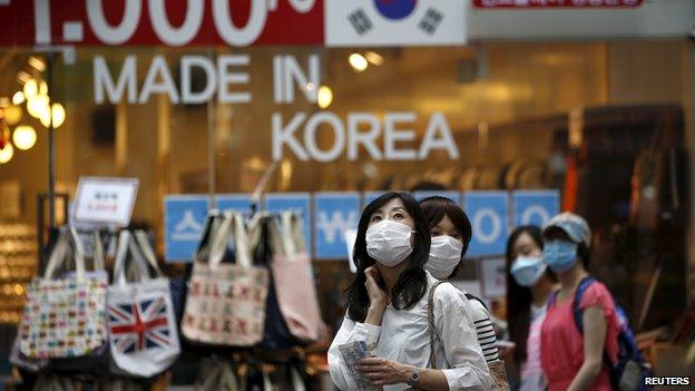 Shoppers with face masks