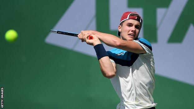 Arthur Fery returns a ball in a recent British Tour match