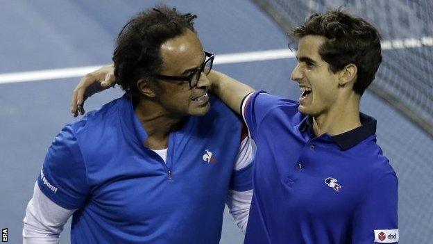 France captain Yannick Noah (left) celebrates with Pierre-Hugues Herbert after their victory in Tokyo