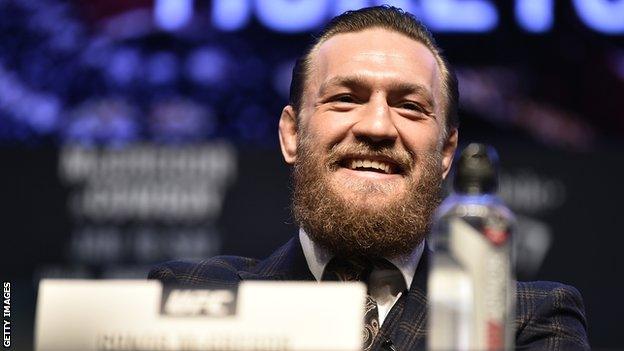 Conor McGregor laughing at the press conference for his fight with Donald Cerrone