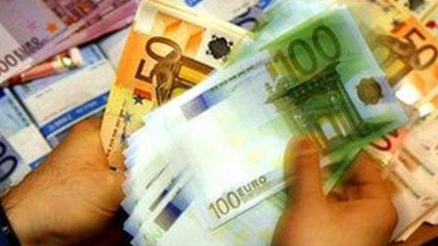 Cashier counting euro notes