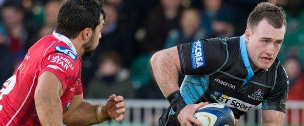 Glasgow's Stuart Hogg (right) in action against Scarlets