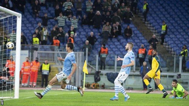 Olivier Ntcham's 95th-minute goal put Celtic into the last 32 with two games to spare