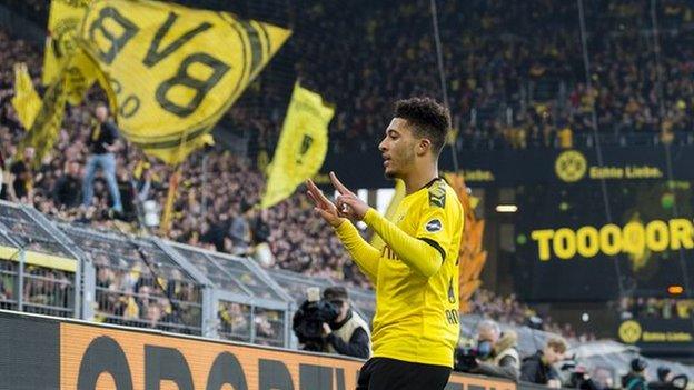 Jadon Sancho celebrates scoring