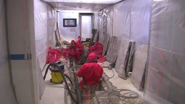 Asbestos being removed from the basement of Buckingham Palace. Still image from Nicholas Witchell package, June 2014