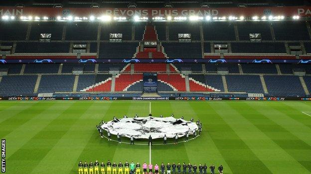 Teams line up during the Champions League anthem