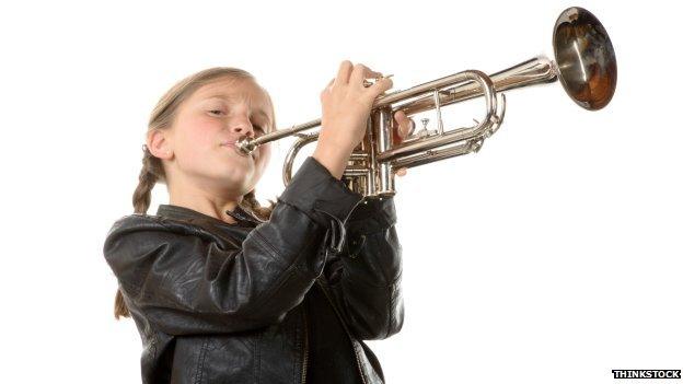 Child playing instrument