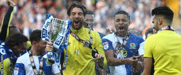 Charlie Mulgrew celebrates after Blackburn win promotion