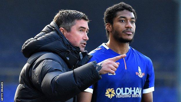 Harry Kewell with Oldham defender Raphael Diarra