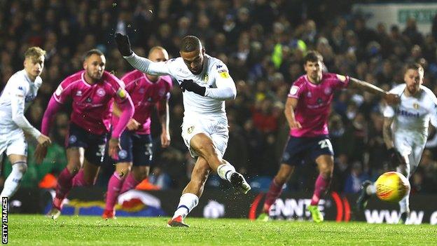 Leeds striker Kemar Roofe scores a penalty against QPR