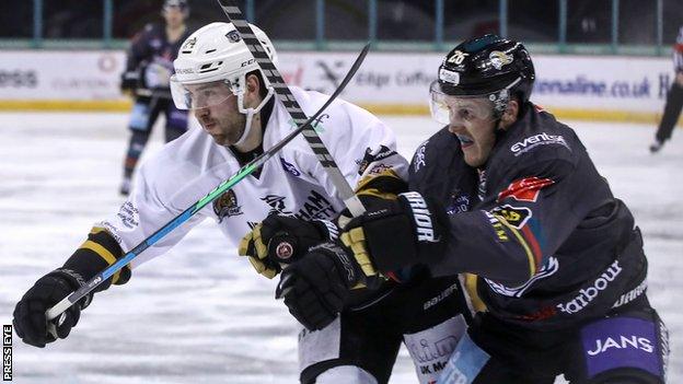 Belfast Giants' Mark Cooper battles with Nottingham's Aaron Thow at the SSE Arena