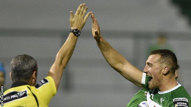 Alberto Sgarbi celebrates one of Treviso's tries, awarded by referee John Lacey