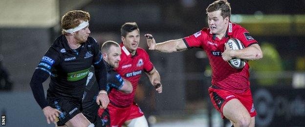 Chris Dean of Edinburgh holds off Glasgow Warriors' Rob Harley