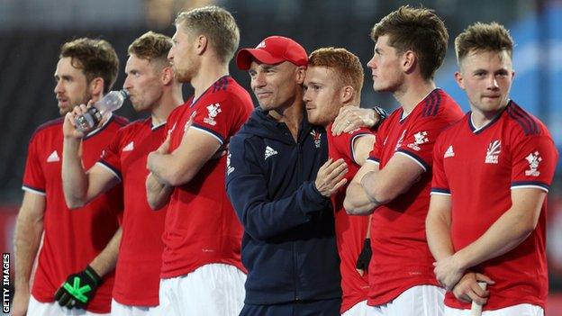 Danny Kerry hugs a GB men's hockey player