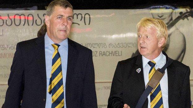 Scotland assistant manager Mark McGhee and manager Gordon Strachan arrive at Tbilisi airport