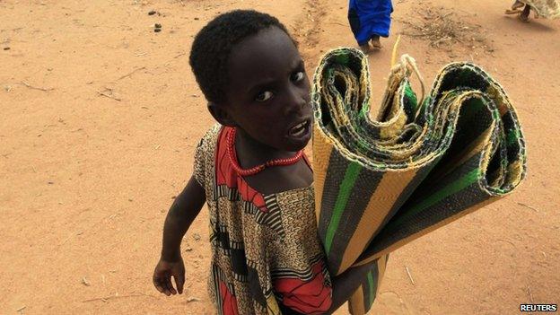 A girl arrives at a refugee camp in Kenya