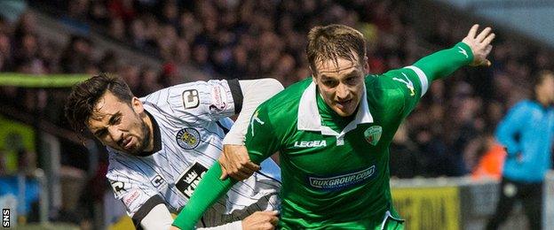 St Mirren's Stelios Demetriou and The New Saints' Chris Marriott