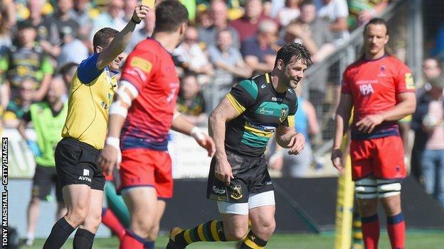 Ben Foden is shown a yellow card by referee Luke Pearce on his final appearance for Northampton