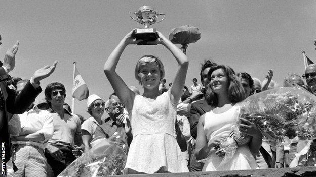 A young Sue Barker holds up the French Open trophy in a black and white photo