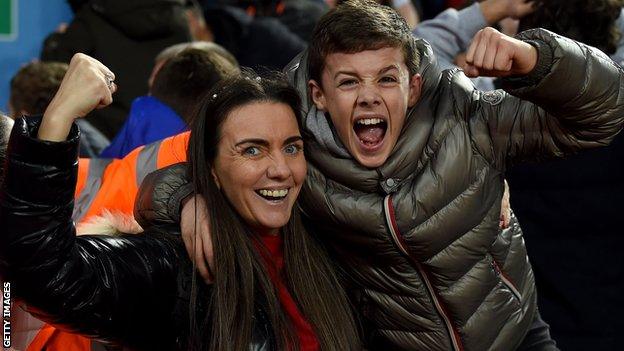 Liverpool fans celebrate their win over Aston Villa