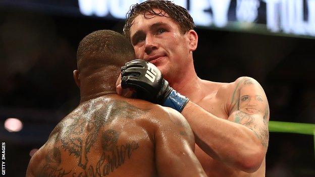 Darren Till congratulating Tyron Woodley after being beaten by the American