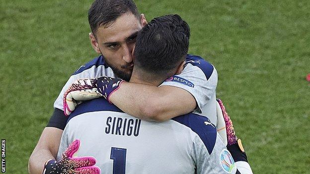 Gianluigi Donnarumma embraces his replacement Salvatore Sirigu