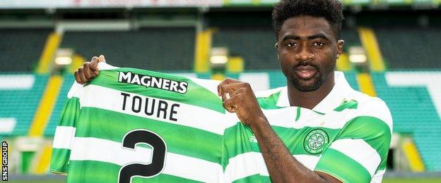 Kolo Toure shows off his new kit