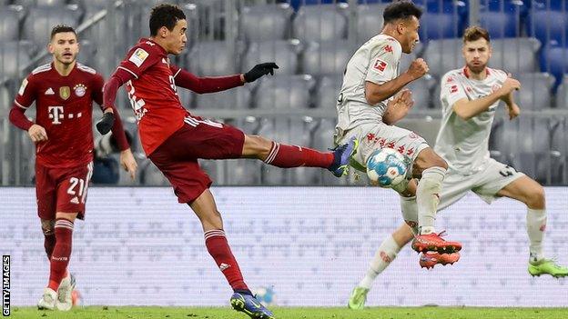 Bayern Munich's Jamal Musiala strikes the ball