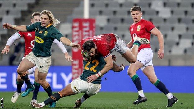 Robbie Henshaw flies through the air as he is tackled