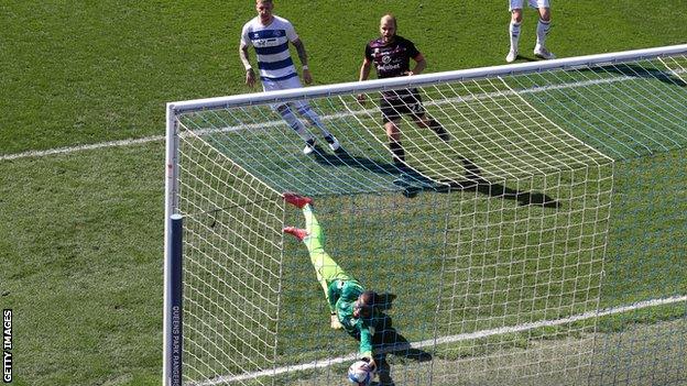 Seny Dieng attempts to save Xavi Quintilla's shot at the second attempt