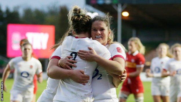 Leanne Infante and Claudia MacDonald celebrate a try