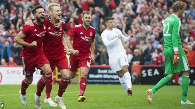 Gary Mackay-Steven celebrates scoring from the spot