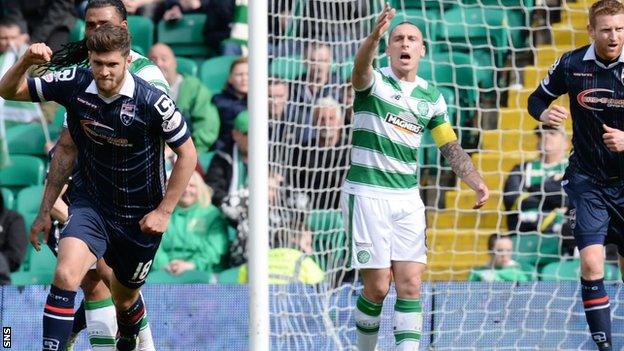 Celtic captain Scott Brown complains as Ross County goal-scorer Stewart Murdoch celebrates