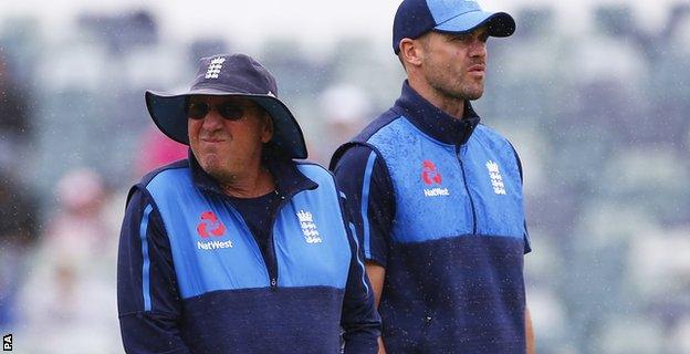 Trevor Bayliss and James Anderson inspect the pitch during the rain delay on the fifth day in Perth