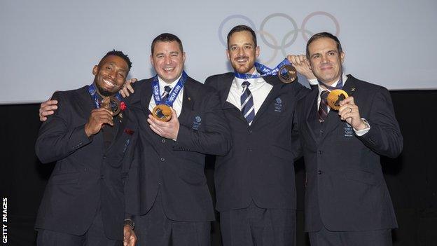 Fearon, Tasker, Benson and Jackson celebrate with their medals at long last